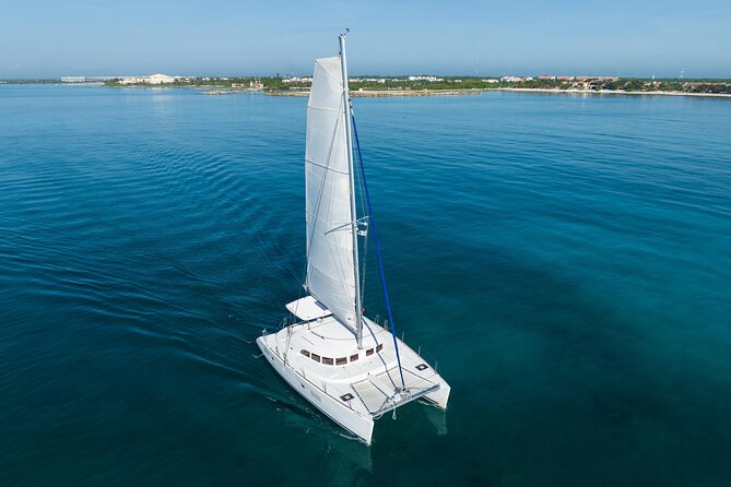 8-Hour Private 38 Catamaran 2-Stop Tour to Cozumel With Food,Open Bar & Snorkel - Tour Highlights