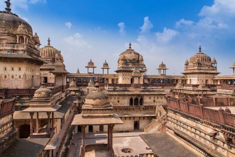 A Day Tour of Orchha & Jhansi Fort from Khajuraho with Guide - Transportation, Duration, and Group Size