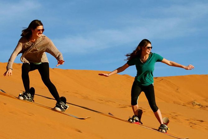 Abu Dhabi Desert Safari 4x4 Dune Bashing & Camel Riding & Sand Boarding With BBQ - Try Your Hand at Sand Boarding