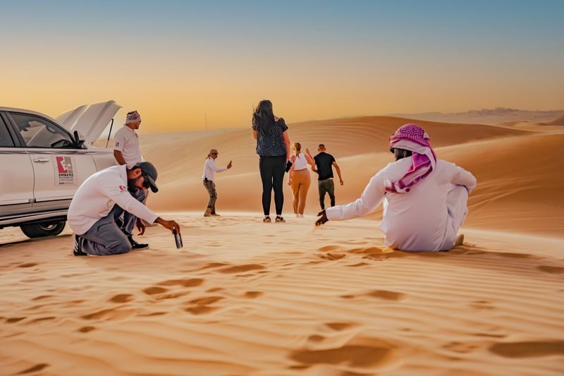 Abu Dhabi: Desert Safari with BBQ, Belly & Tanoura Dance - Sunset, dates and Arabic coffee at the camp