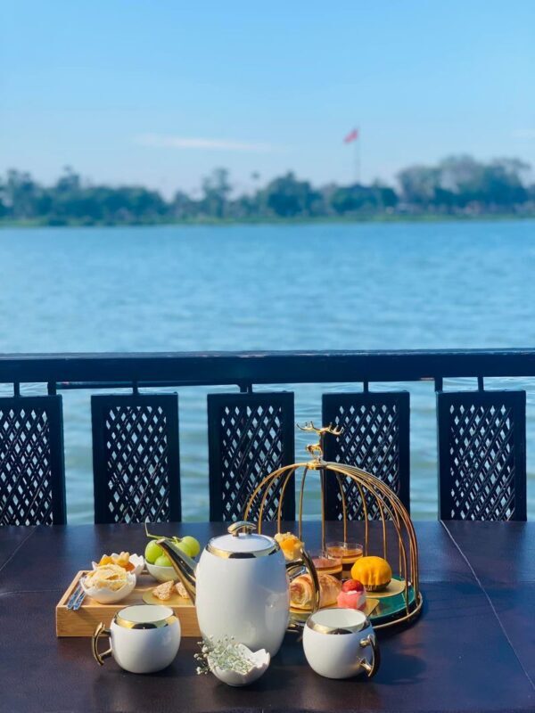 Afternoon Tea Perfume River Sunset Cruise Experience in Hue City - The boat, the guide and the group