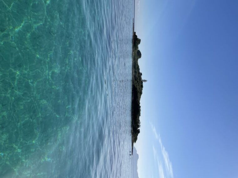 Alcudia: Traditional Wooden Boat Trip With Snorkeling - Sightseeing at Alcanada Lighthouse