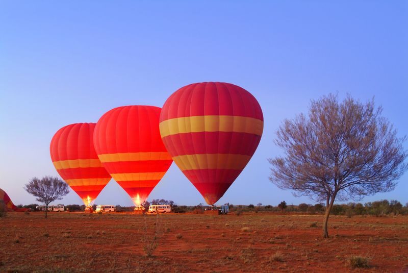 Alice Springs Early Morning Hot Air Balloon Experience - At the launch site: cold air, dust and preparation
