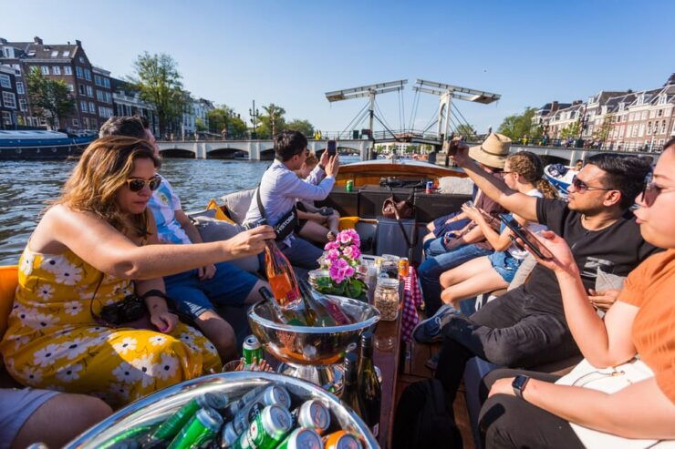 Amsterdam: 1.5-Hour Canal Cruise With Guide Drinks & Snacks - Pricing and Discounts