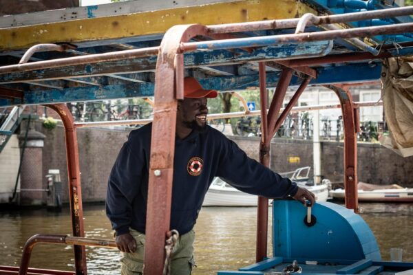 Amsterdam: Canal Cruise on a Wooden Refugee Boat - Onboard Comforts and Refreshments