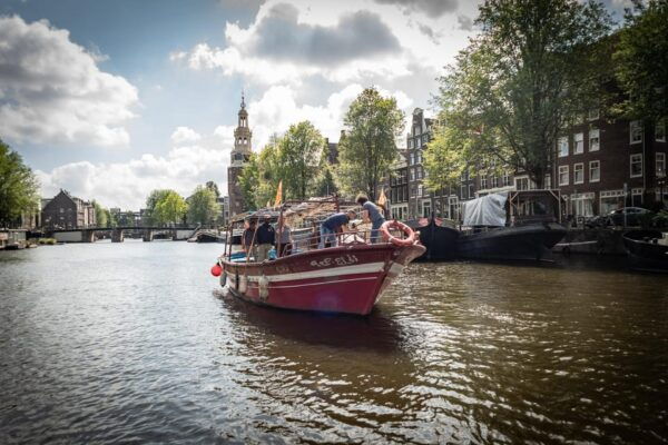 Amsterdam: Canal Cruise on a Wooden Refugee Boat - Booking Details and Cancellation Policy