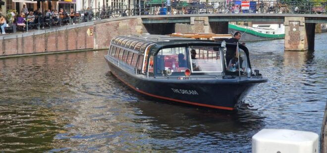 Amsterdam Canal Cruise With Live Guide and Bar on Board - Highlights of the Amsterdam Canal Cruise Experience