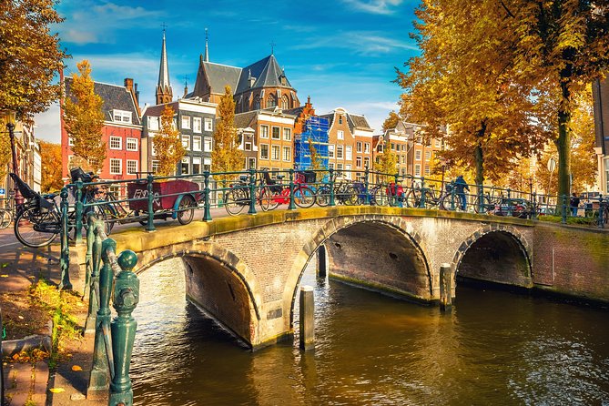Amsterdam Classic Boat Cruise With Live Guide, Drinks and Cheese - Meeting and Pickup