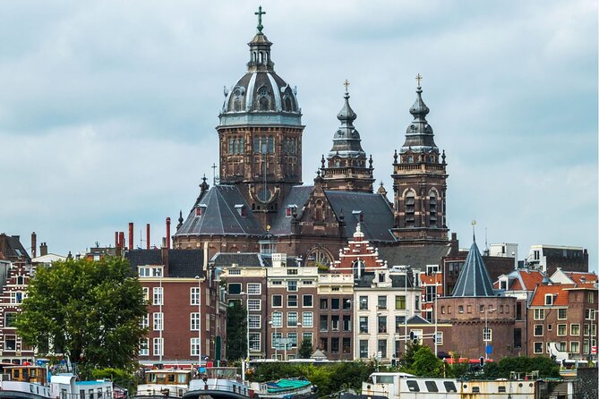 Amsterdam Highlights With Local: Walking Tour & Canal Cruise - Dutch Architecture and Design