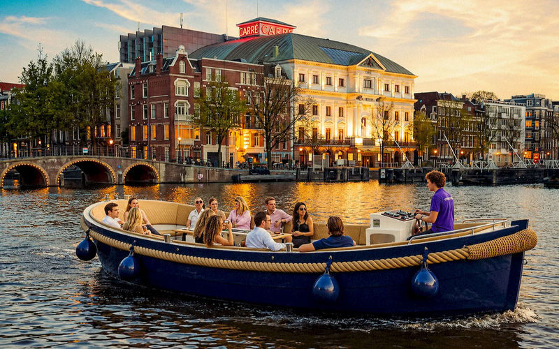 Amsterdam Luxury Cruise Tour with Cocktail Option - Open boat comfort, with weather as the catch