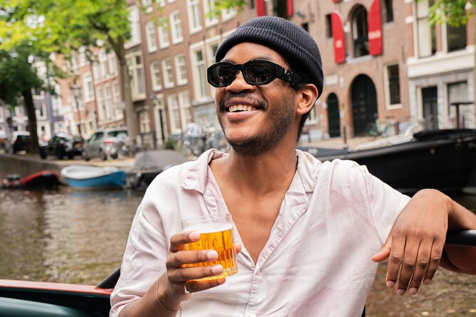 Amsterdam Open Boat Evening Canal Tour Local Guide and Open Bar - Meeting and Pickup