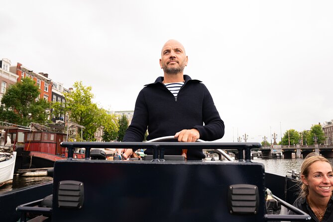 Amsterdam Open Boat Evening Canal Tour Local Guide and Open Bar - Frequently Asked Questions