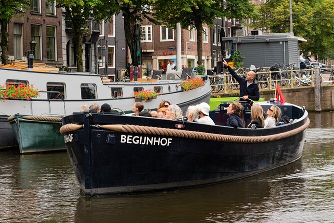 Amsterdam Open Boat Evening Canal Tour With Guide & Bar on Board - Tour Highlights