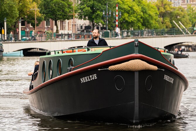 Amsterdam Open Boat Evening Canal Tour With Guide & Bar on Board - Pricing and Guarantee