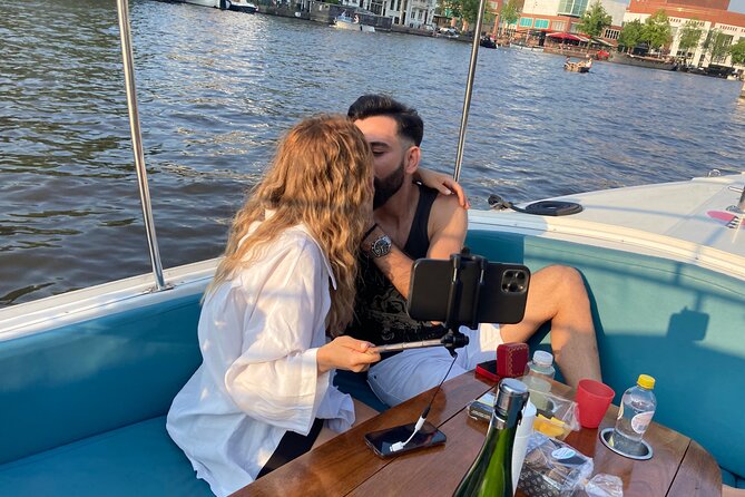 Amsterdam Private Canal Cruise With Live Guide and Drinks - Live Commentary and Eco-Friendly Experience