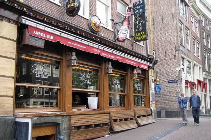 Amsterdam Red Light District and Local Pub Tour - Finishing by the Condomerie and Royal Palace
