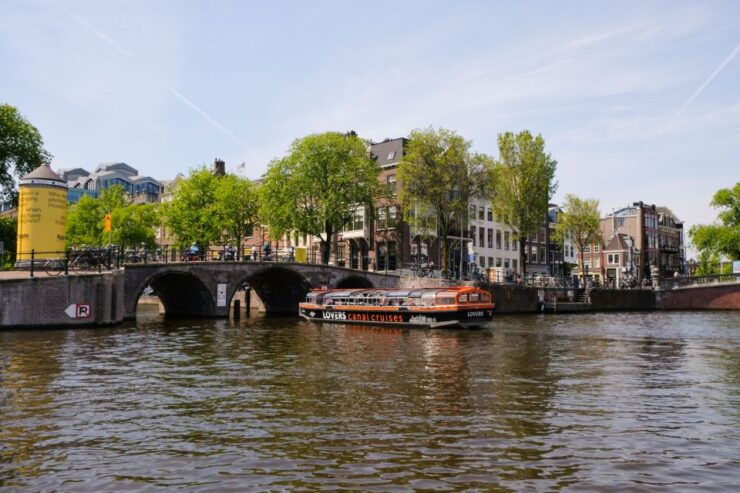 Amsterdam: Semi-Open Canal Boat Cruise - Experience on the Semi-Open Canal Boat