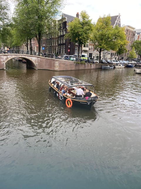 Amsterdam Small-Group Canal Cruise Including Snacks/Drinks - Captivating Stories From Experienced Captains