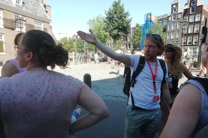 Amsterdam Walking Tour With a Local Comedian as Guide - Pricing and Booking Information