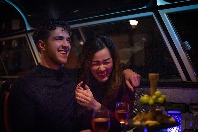 Amsterdam Wine and Cheese Evening Canal Cruise - Canal views after dark, with weather in mind