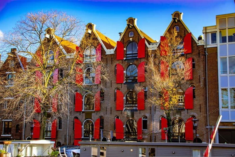 Amsterdam:1.5-Hour Canal Cruise local Guide, Drinks & Snacks - The Itinerary and Its Highlights