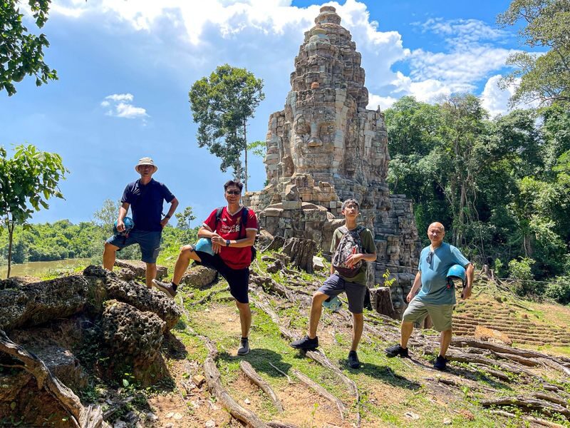 Angkor Wat Temples and Countryside Tour with Sunrise or Sunset - Ta Prohm, where roots take over the stone