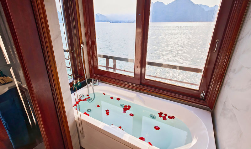 Aqua Elegance 2D1N Cruise: Ha Long Bay Tour with Sung Sot & Ti Top - Sunset, cooking, and an evening aboard