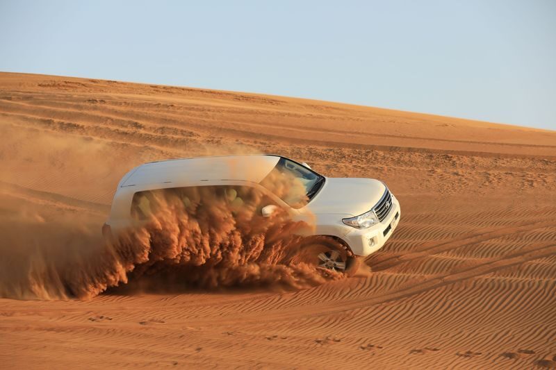 Arabian Desert 4-Hour Guided Safari Experience - Stops for photos, camels, and possible extras