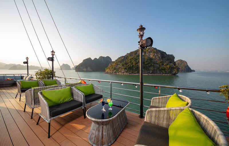 Aurora Day Cruise: Ha Long Bay with Sung Sot & Ti Top - The sundeck sunset party is the easygoing finish