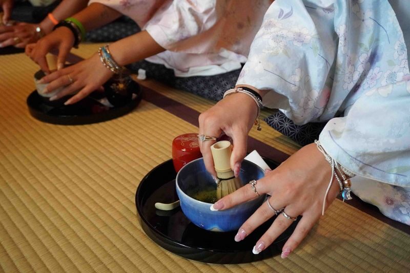 Authentic Tea Ceremony, Calligraphy in Kyoto with River View - Trying calligraphy with a brush