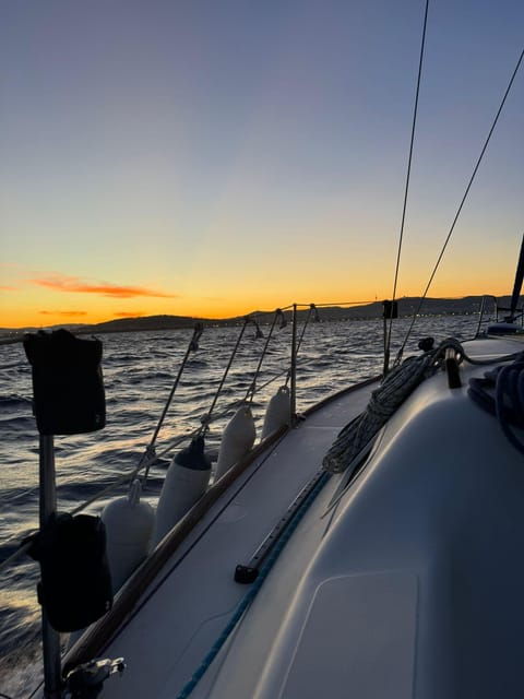 Barcelona: Sunset Sailboat Cruise With Drinks and Snacks - Key Points
