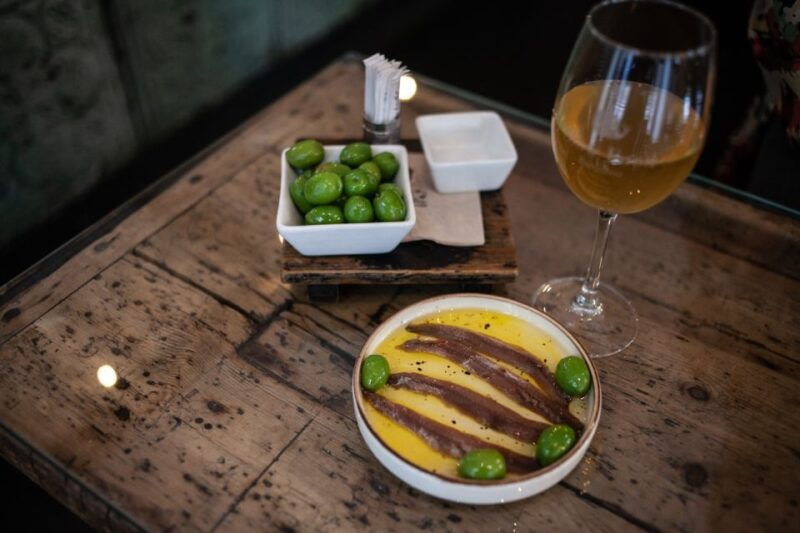 Barcelona: Tapas Food and Wine Tour in La Barceloneta - Itinerary and Highlights