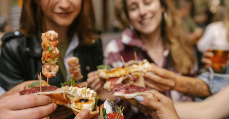 Barcelona: Tapas Food Crawl Walking Tour With Tastings - Exploring the Vibrant Neighborhoods