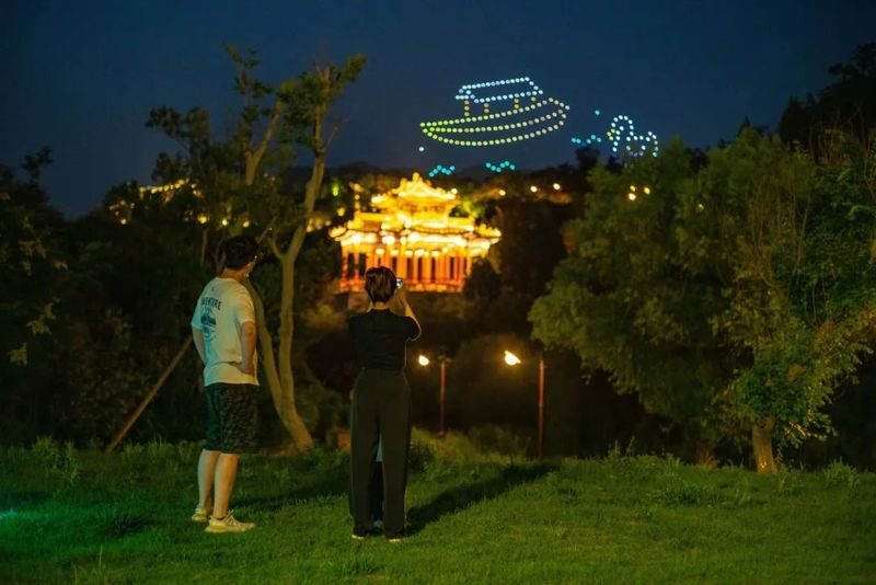 Beijing Gubei Water Town 1-Day Tour - Simatai after dark, with a clock to watch