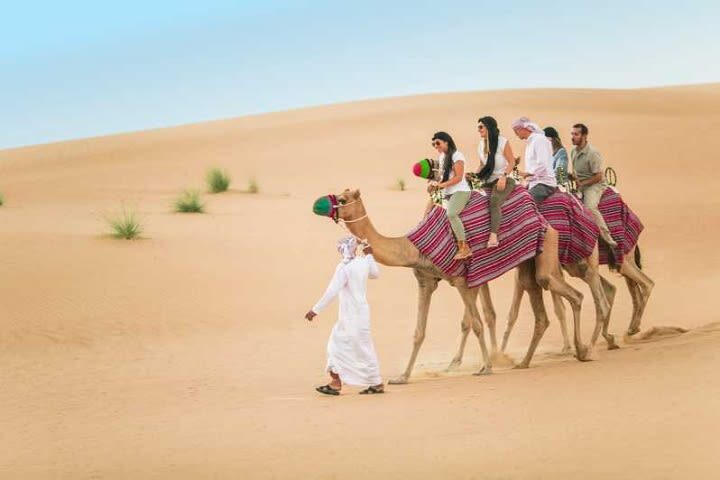 Best Desert Safari Tours in Dubai - Sandboarding, camel rides, and sunset photos