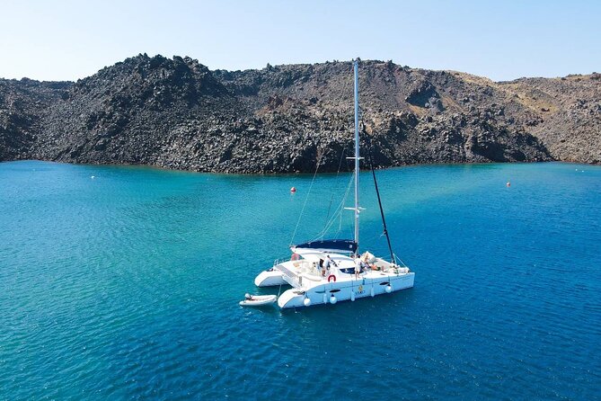 Best of Santorini Private Half-Day Catamaran Cruise With Transfer and Meal - Pricing and Booking