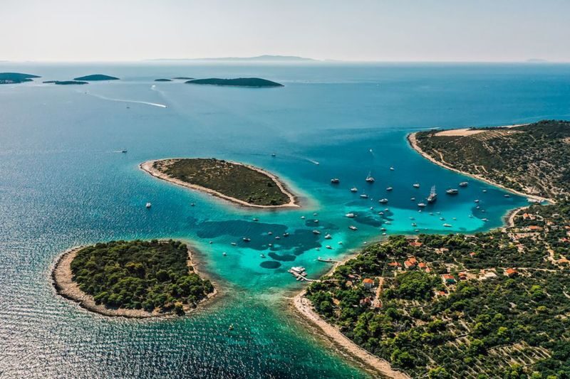 Blue Lagoon and 3 Islands Speedboat Tour from Split - Trogir adds a historic counterpoint