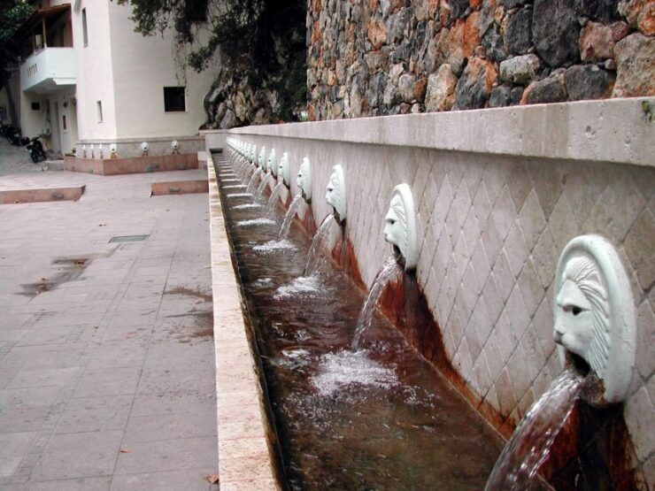 Botanic Garden - Spili - Preveli - Plakias Tour - Spili Village Lion Stone Heads
