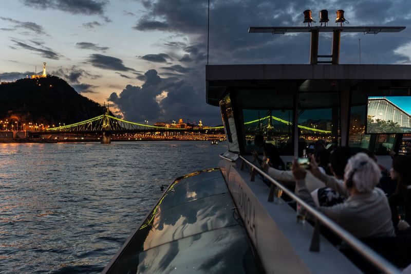 Budapest Evening Cruise with Drink & Audio Guide - A drink in hand, with a few practical limits