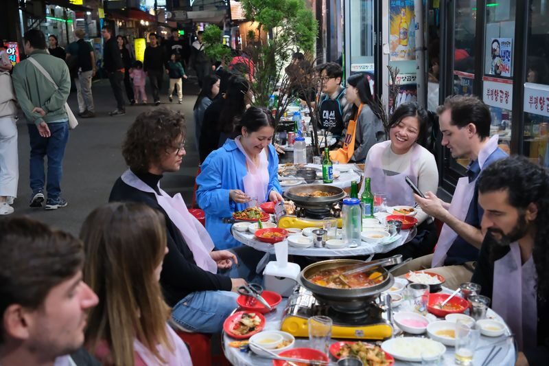 Busan Authentic Korean BBQ Experience - Local Food Guide & Cultural - A barbecue table built for sharing