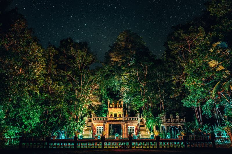 Cairns: Paronella Park Night Tour, Small Group - Castle ruins from afternoon light to night