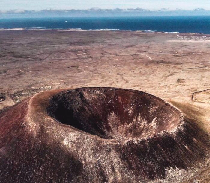Caleta De Fuste/Corralejo: Guided E-Bike Tour & Crater Hike - Discovering the Charming Town of El Cotillo