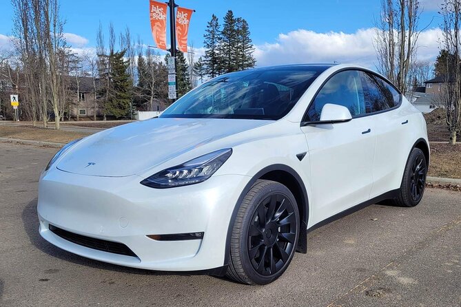 Calgary to Banff in Tesla EV - Private Transfer - Convenient Airport Pickup and Luggage Assistance