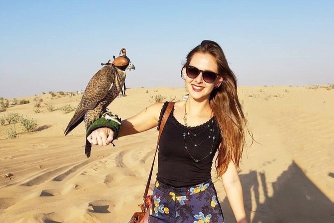 Camel Rock Desert Safari Dubai With Bbq Dinner Camel Ride Sand Boarding & More - The Sum Up