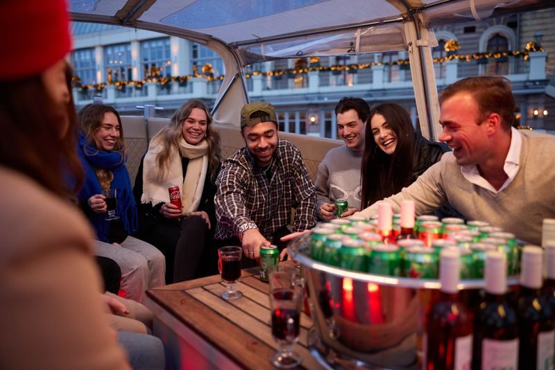 Canal Booze Cruise with Unlimited Drinks Option in Amsterdam - From Oudezijds Voorburgwal to the Water