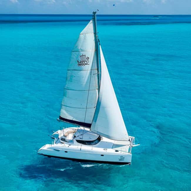 Cancun: Premium Catamaran with Transportation & Dock fee - Snorkeling at the Reef: A Colorful Encounter