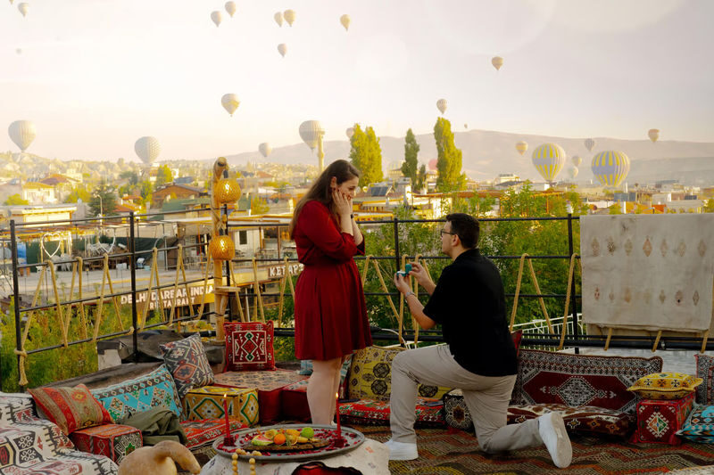 Cappadocia: Rooftop Photoshoot with Hot Air Balloons at Sunrise - A sunrise portrait with Cappadocia behind you