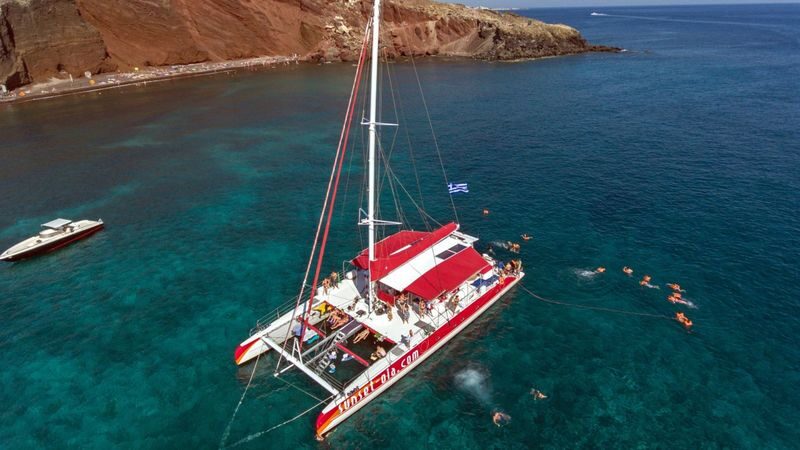 Catamaran red cruise experience with meal in Santorini - Swimming near the Red and White beaches