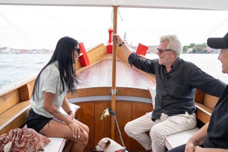 Check out Venice from a different angle: a scenic tour on a traditional boat. - The Sum Up