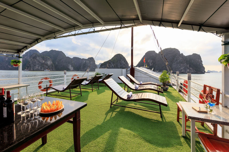 Cozy Bay Classic 2D1N Cruise: Ha Long Bay, Sung Sot, Ti Top - Sunset on deck, then dinner and evening activities
